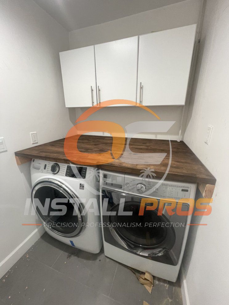 Custom butcher-block countertop built over a front-load washer and dryer